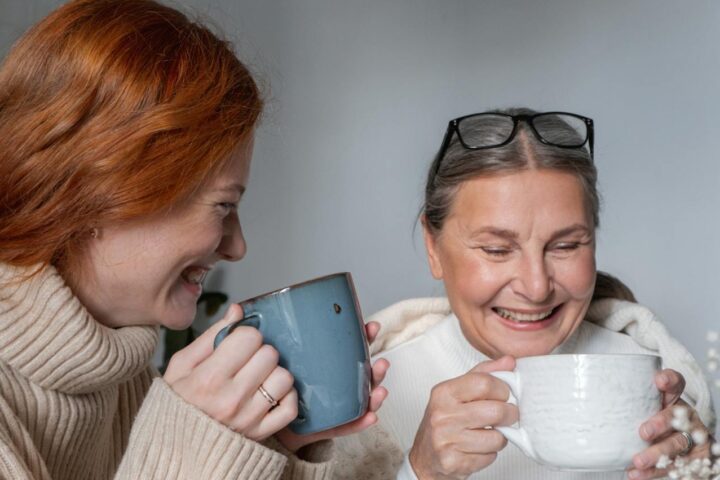 Two women chatting with a cup of tea