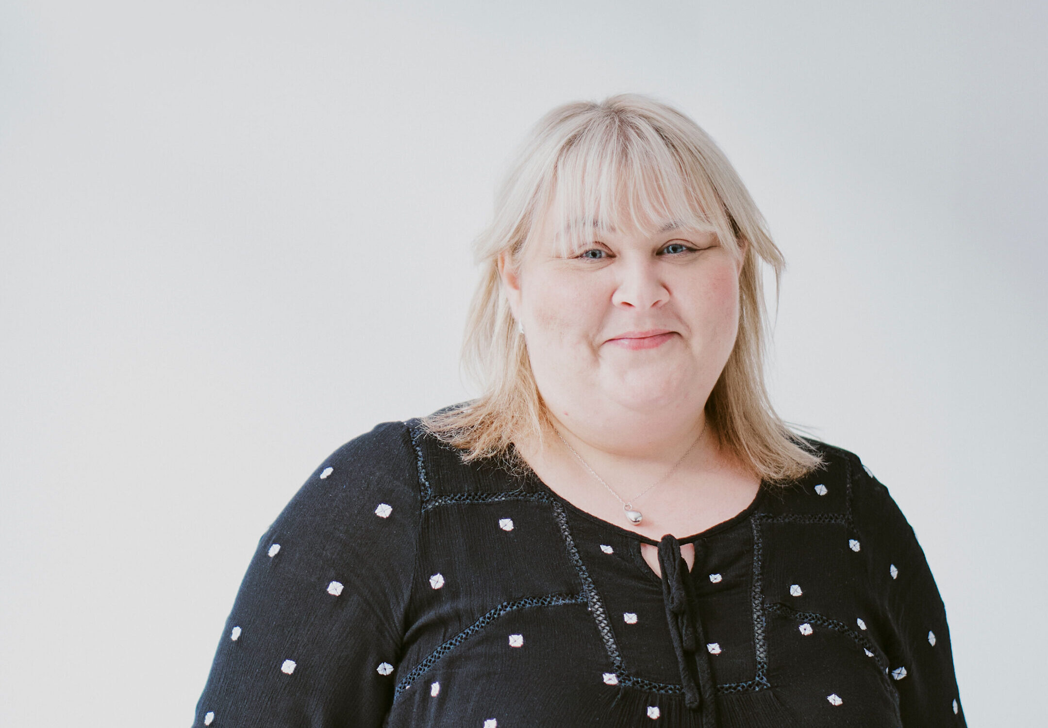 A community support woman posing for a portrait image