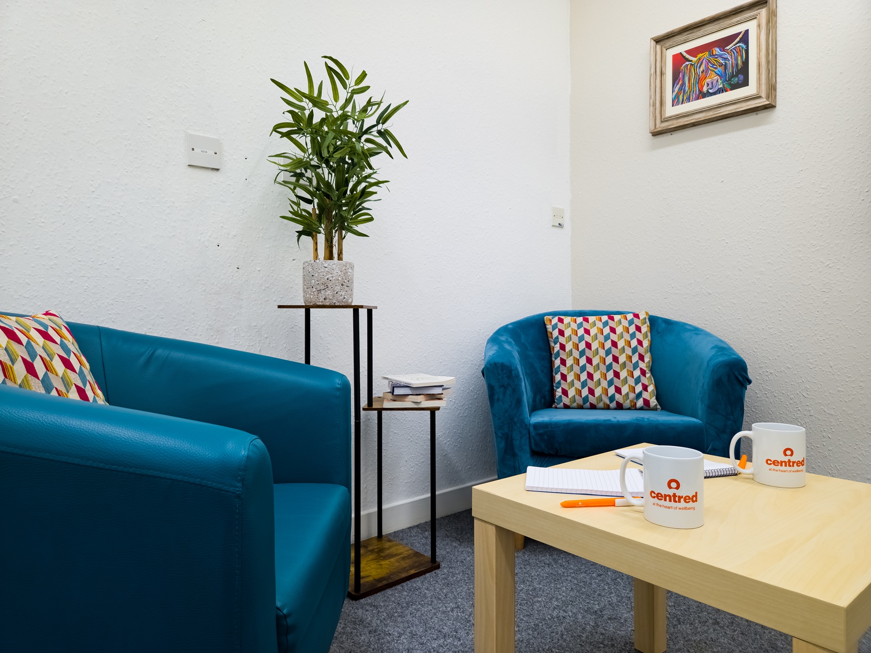 Small meeting room with two chairs and a table