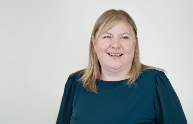 Picture of woman smiling with shoulder length blonde hair