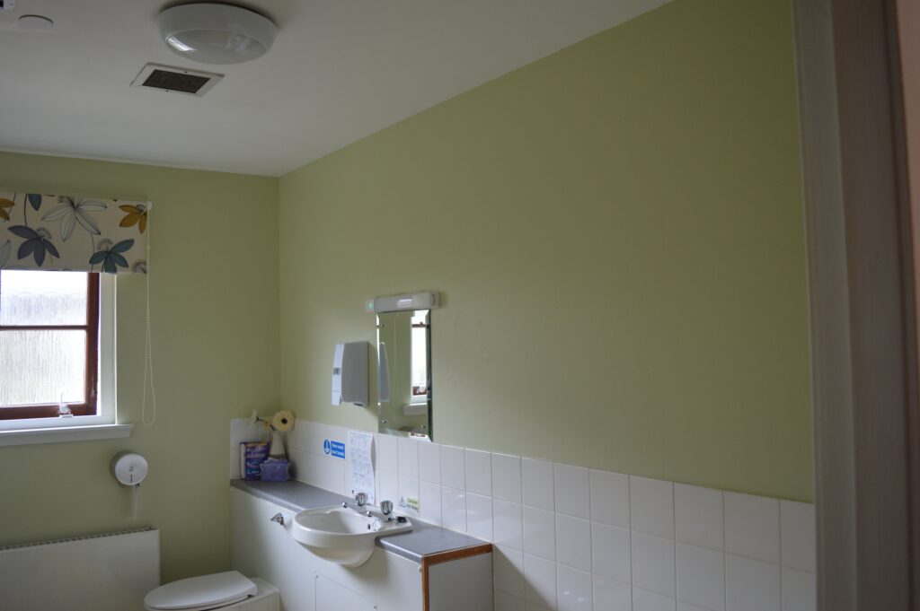 Bathroom with freshly painted yellow walls